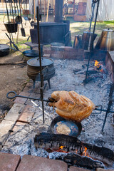 Turkey Cooking on Spit at a Gold Rush Camp