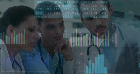 Medical team wearing scrubs and stethoscopes interpreting digital charts in clinical workspace