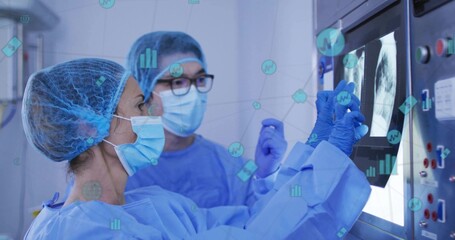 Examining colleagues in blue scrubs discussing chest X-ray in radiology room, with data overlays