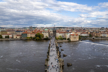 Fototapeta premium Beautiful Aerial view of the Old Town Bridge Tower, the Charles Bridge (Karlův most) and the City of Prague