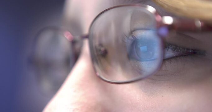 Girl at computer Close up on eye 4k