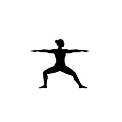 Silhouette of a woman performing warrior ii yoga pose for fitness and wellness