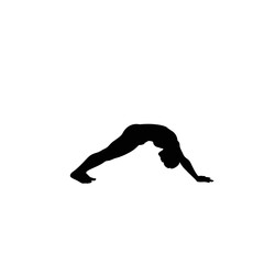 Silhouette of a person performing a yoga pose showing flexibility and strength in a dynamic posture