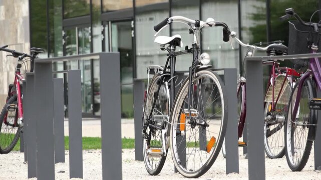 Bikes locked to posts on university campus 4k