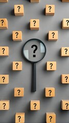 Magnifying Glass Focusing On Question Mark Among Many Wooden Cubes Symbolizing Curiosity Problem Solving And Confusion