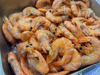 pile of raw shrimps prawn fresh ice cold storage on market or supermarket at the morning