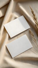 Minimal Blank Business Cards On Beige Fabric Background With Dried Plant Perfect For Branding And Mockup Design