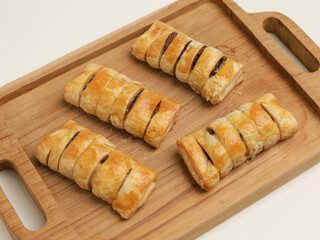 Baked pastry on wooden tray