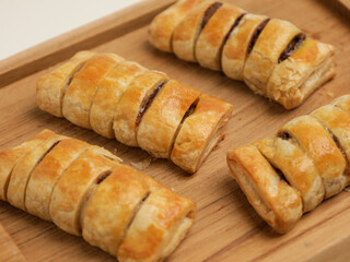 Baked pastry on wooden tray