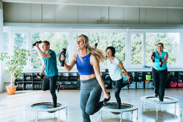 Team workout in gym with active people practicing yoga and fitness activities for energy strength...