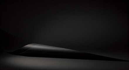 Modern black paper surface featuring soft light and shadow gradients, perfect for minimal photography and design.