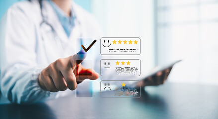 Doctor using digital interface to select five-star rating for healthcare service feedback, concept...
