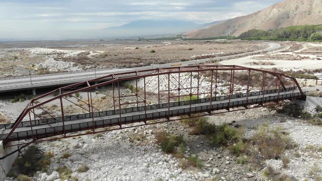 The Greenspot Bridge in Mentone California a Camelback Truss Bridge From a Drone Aerial Vehicle over the Santa Anna River