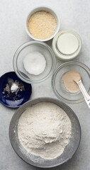 Overhead view of mise en place of ingredients for making english muffin bread, process of making english muffin bread