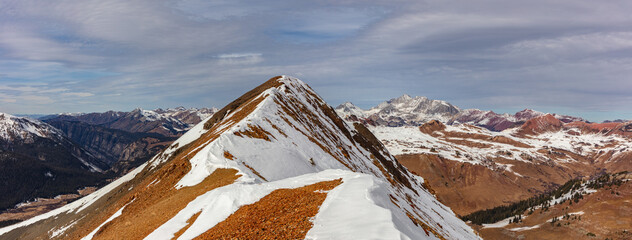 With partial snow covering the beautiful Elk Range Peaks near Crested Butte, Colorado, the stunning colors of these mountains, including Mount Belleview, are still on display. © Nick Monitello