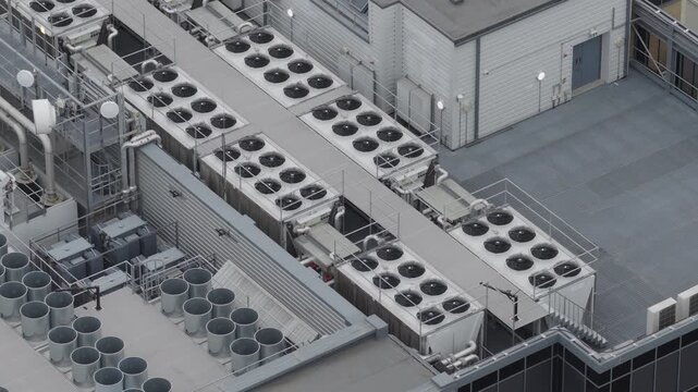 Aerial view of rooftop of data center with HVAC and ventilation systems. AI infrastructure and power consumption concept