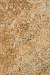 表面に凸凹のある茶色い石のクローズアップ。石や岩のテクスチャー