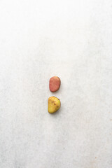 Overhead view of kola nut on white granite countertop, top view of fresh kolanut often used for religious ceremonies in african communities