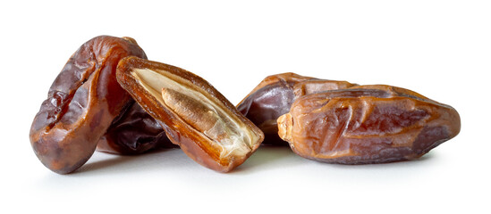 Ripe dried date palm fruits witth half in stack isolated on white background with clipping path Concept of iftar food in Ramadan month for Muslims
