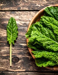 Fresh Green Sorrel Leaves on Wooden Table - A Culinary Herb.