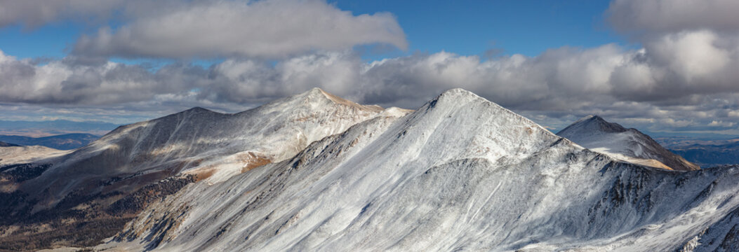This autumn panorama highlights the snow-covered 13er Cronin Peak and the nearby 14er, Mount Antero.

