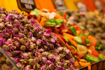 Colorful display of dried flowers and fruits at market