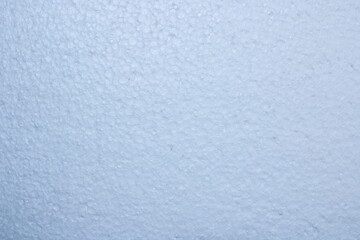 Close up texture of white styrofoam surface with soft lighting