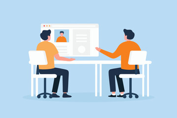 Two people sitting at a desk looking at a computer screen displaying a profile page during a meeting or interview