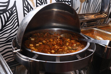 vegetarian and non vegetarian cuisine arranged in a hotel