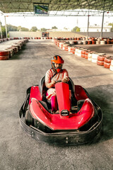 Go-kart driver racing on a track, showing speed, control, and adrenaline of motorsport competition. Perfect for concepts of adventure, action, and professional racing lifestyle.