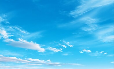 Fototapeta premium A serene blue sky with minimal clouds, creating an atmosphere of tranquility and freedom