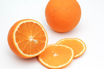 Fresh Orange Fruit and Slices on White Background