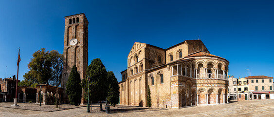 A panoramic view of the historic Basilica dei Santi Maria e Donato in Murano, featuring its...