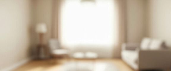 Blurred interior view of a modern living room with sofa chair and wide window, softly illuminated by daylight that enhances the cozy elegant mood of the home space.