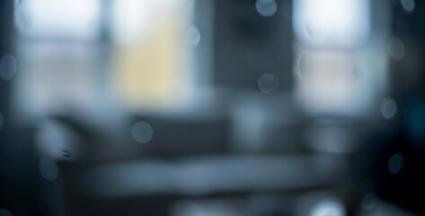 Abstract blurred background with glowing bokeh lights in soft blue and white tones, creating a dreamy calm atmosphere perfect for modern minimalist visual design concepts.