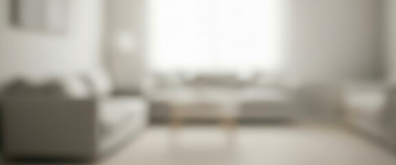 Blurry interior view of a living room with a sofa and window, filled with soft daylight, gentle shadows, and a peaceful, modern atmosphere that feels warm and welcoming.