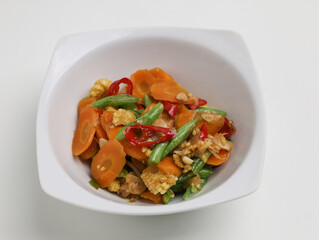 Stir fry vegetables in white bowl