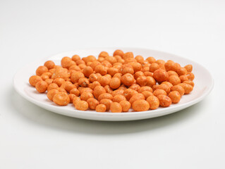 Flour coated peanuts on white background