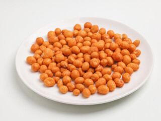 Flour coated peanuts on white background