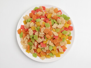 Raw crackers, piled on white background