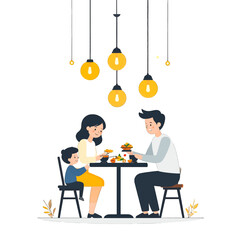 Family Enjoying Meal Together Around Black Table With Hanging Lights in Bright Setting