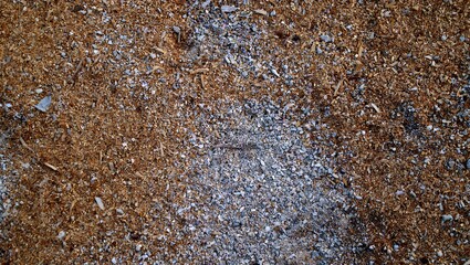 Rough brown gravel texture close-up outdoor surface