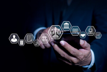 Business ethic concept businessman or lawyer using smart phone touches virtual icons symbolizing law, justice, and legal services. business legislation, Notary public, legal advice online, Lawyer