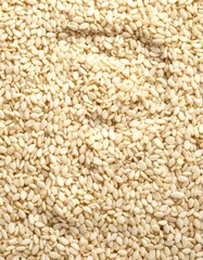 Fototapeta premium Close-up macro view of numerous off-white sesame seeds