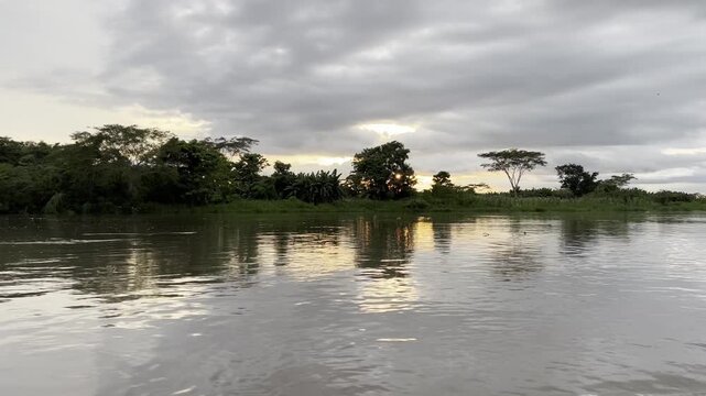 Boat ride on the majestic R&iacute;o Magdalena near the charming town of Santa Cruz de Mompox between Bol&iacute;var Department and Magdalena Department in Colombia at sunset
