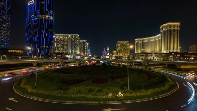 Night time lapse of Cotai Strip Macau with traffic light trails and casinos skyline.