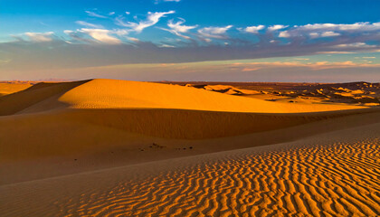Golden Sand Dunes under a Cloudy Sky in the Desert.