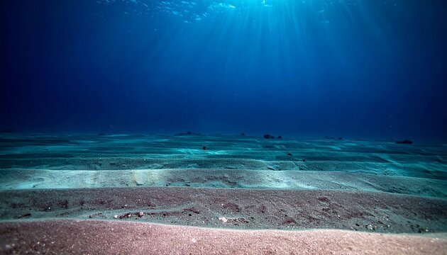 Serene underwater landscape with sandy seabed and sunbeams.