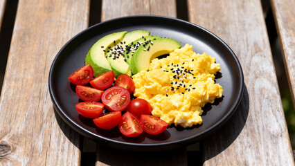 Scrambled eggs avocado and tomatoes