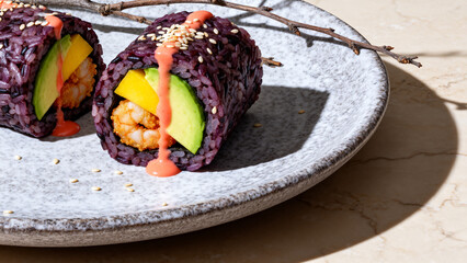 Purple rice sushi rolls with avocado and shrimp